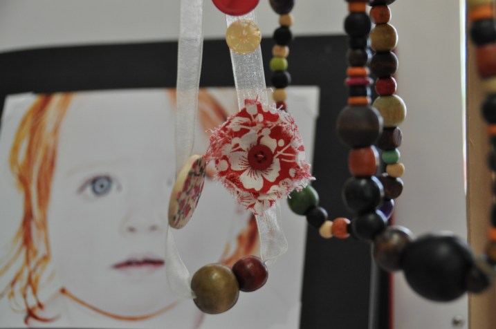 hand made necklace, off set fabric and natural wood on satin ribbon.